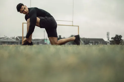 Athlete tying his shoe laces