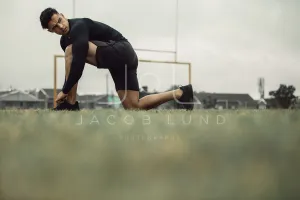 Athlete tying his shoe laces